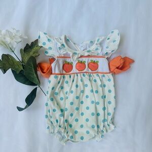 Polka Dot Baby Romper with Orange Accents